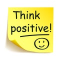 Yellow sticker with black postit - `Think positive!`, note hand written